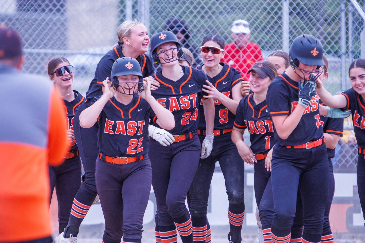 St. Charles East's Emily Moline (24) celebrates after hitting a three run home run against Schaumburg at the Class 4A St. Charles East Regional Final on Friday, May 22,2026 in St. Charles.