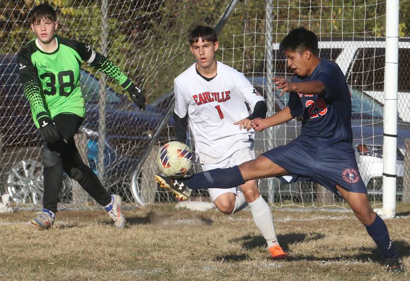 DePue/Hall's Nery Yaxcal kicks the ball away from Earlville's Juan Vazquez during the Class 1A Regional quarterfinal game on Wednesday, Oct. 16, 2024 in DePue.