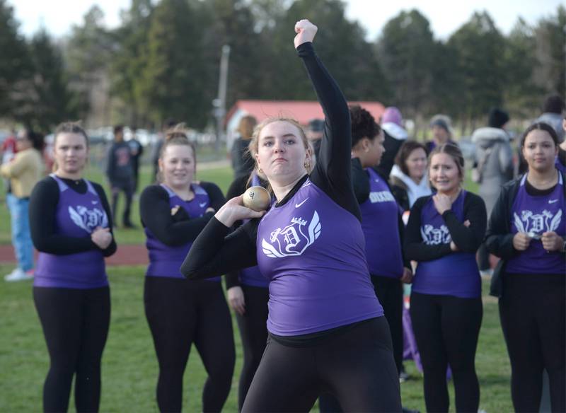 Dixon's Eliza Zimmerman throws the shot as her teammates watch at Oregon High School on Thursday, April 3, 2025.