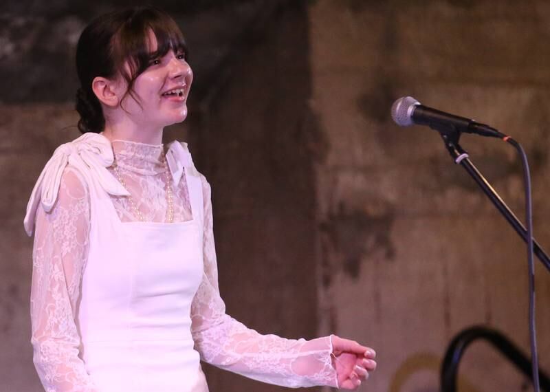 Emily Kmetz a senior at La Salle-Peru Township High School sings during the 7th annual Mad Hatter Ball on Friday, Nov. 17, 2023 at the Westclox Event Center in Peru.