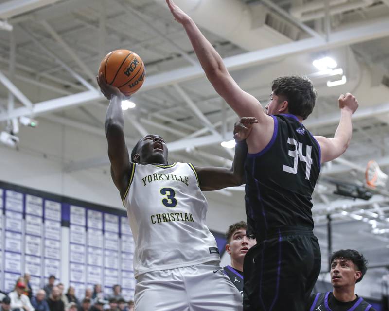 Yorkville Christian's Jayden Riley (3) puts up a shot over Plano's Kevin Martinez (34) during their Plano Christmas Classic semi-final basketball game between Yorkville Christian at Plano Monday, Dec 29, 2025 in Plano.