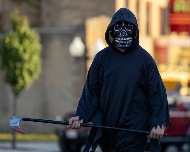 Parader in costume walks down Main Street at the annual Princeton Halloween Parade on Saturday, Oct. 4, 2025 on Main Street in Princeton.