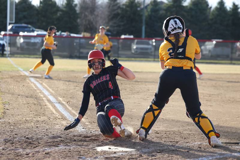 Bradley-Bourbonnais' Suttyn Hop beats a throw at home to score during the Boilermakers' 12-0 victory over Marian Catholic on Tuesday, March 18, 2025. Hammond struck out 12 batters across five shutout innings.