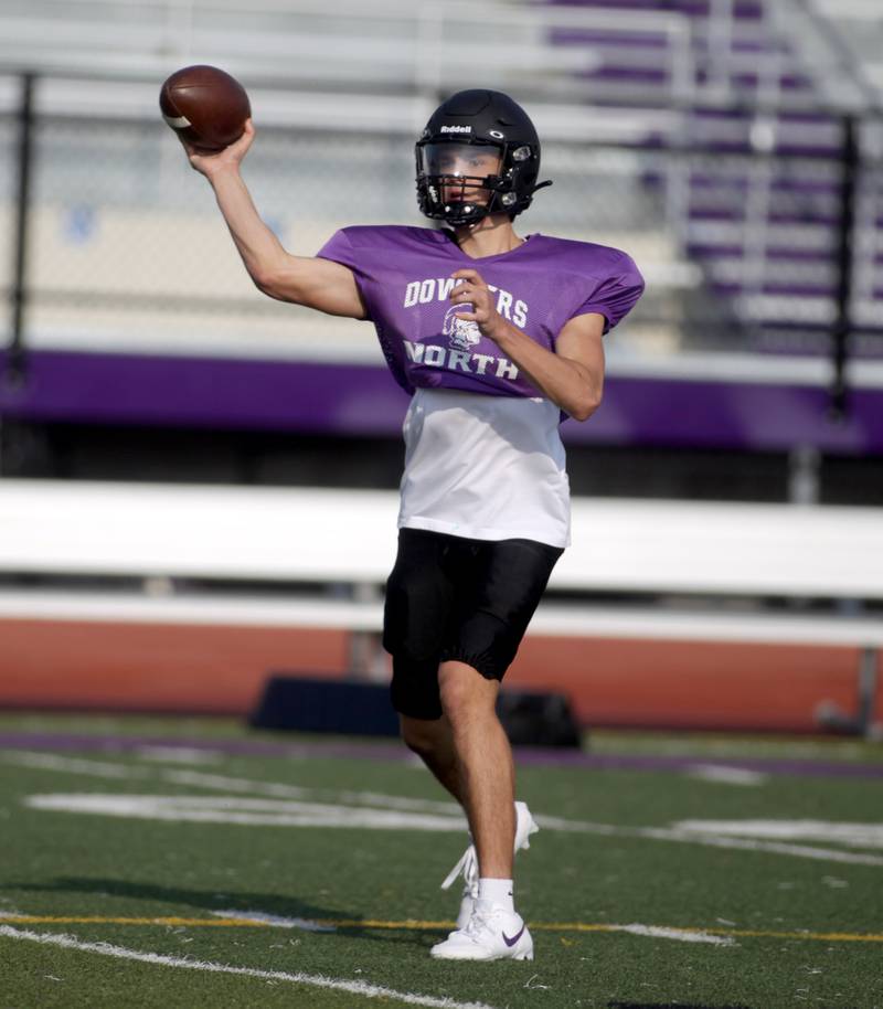 Downers Grove North quarterback Owen Lansu throws the ball during a practice at the school on Tuesday, Aug. 15, 2023.