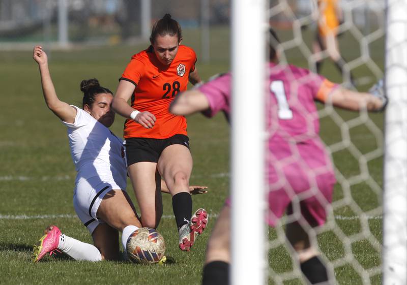 Huntley's Ava Trudeau foals Crystal Lake Central's Jillian Mueller in the box during a Fox Valley Conference soccer game on Tuesday, April 9, 2024, at Crystal Lake Central High School.