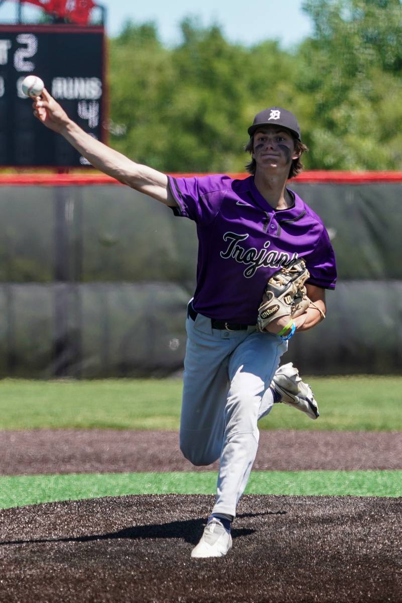 Downers Grove North's Jude Warwick (4) delivers a pitch against Oswego East during a 4A Bolingbrook Regional Championship baseball game at Bolingbrook High School on Saturday, May 25, 2024.