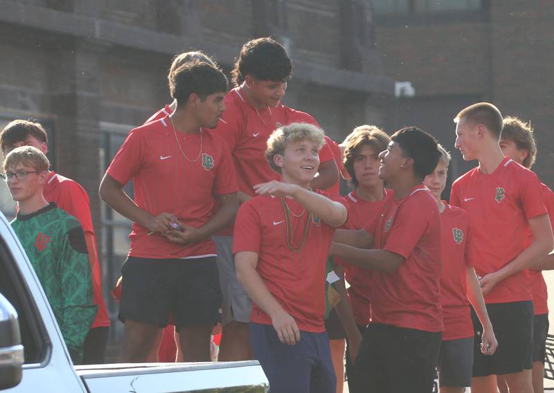 Members of the L-P boys soccer team ride on a float during the L-P homecoming parade on Thursday, Oct. 2, 2025 downtown Peru.