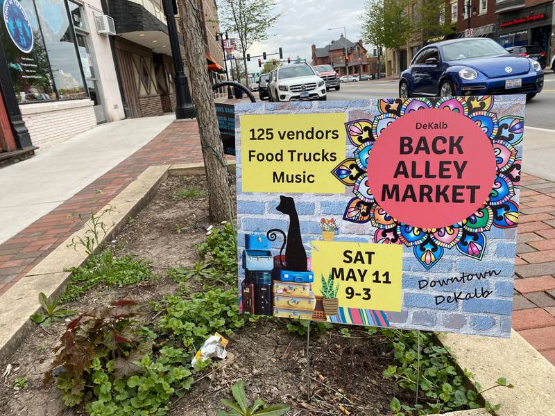 A sign advertising the next Back Alley Market on Saturday, May 11, 2024, sits along Lincoln Highway in downtown DeKalb April 26, 2024.