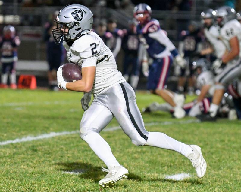 Kaneland's Dylan Sanagustin (2) runs the ball while traveling to take on Belvidere North High School on Friday Nov. 1, 2024, during the first week of playoffs.