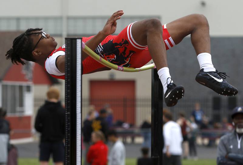 Huntley’s McHale Hood grazes the ball as he competes in the high jump during the IHSA Class 3A Huntley Boys Track and Field Sectional Wednesday, May 18, 2022, at Huntley High School.