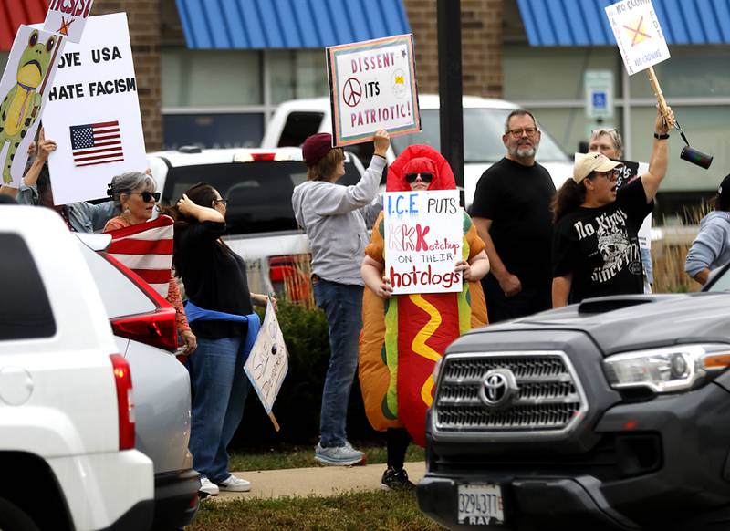 Protesters line Route 31 during a "No Kings” protest rally on Saturday, Oct. 18, 2025, in McHenry. The protest drew thousands of protesters to the area to protest the policies of President Donald Trump.