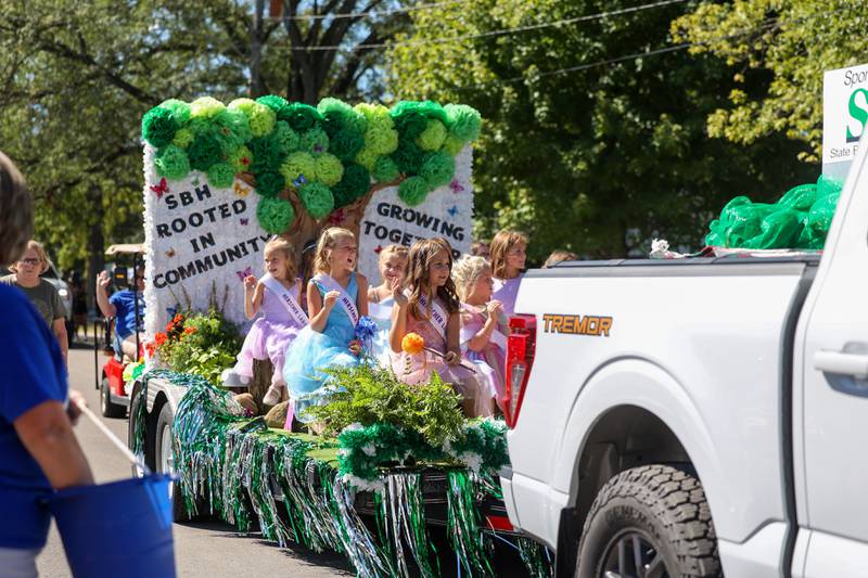 The 2025 Herscher Labor Day Princess Candidates waves as they ride on a float during the 104th annual Herscher Labor Day Celebration Grand Parade on Monday, Sept. 1, 2025.
