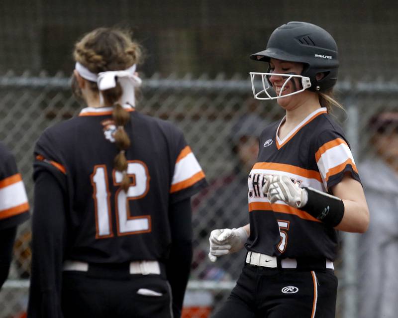 McHenry's Emma Stolzman is all smiles ash she gets ready to touch home plate after hitting.a home run during a non-conference softball game Tuesday March 22, 2022, between Richmond-Burton and McHenry at Richmond-Burton High School.