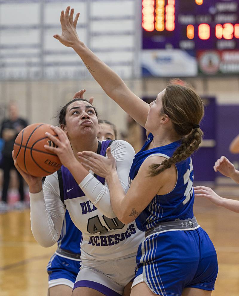 Dixon’s Hallie Williamson looks to put up a shot against Princeton’s Miyah Fox Thursday, Jan. 4, 2024 at Dixon High School.