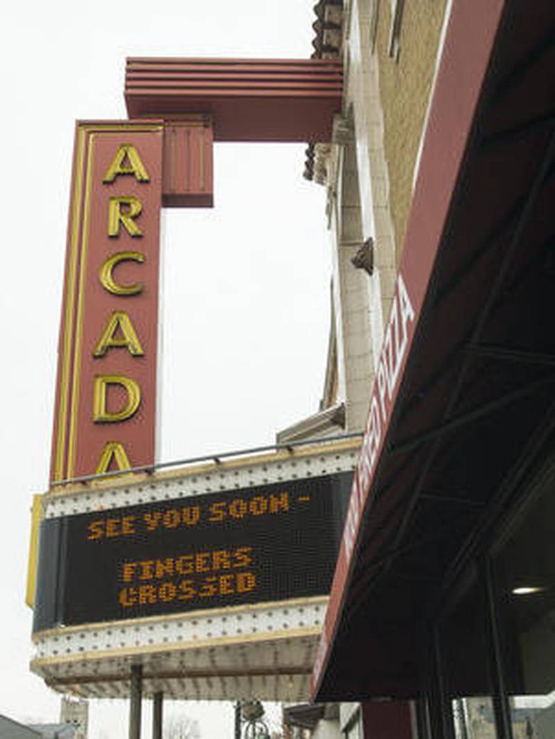 Optimistic messages flash on the marquee as renovations adding restaurants and hotel suites are under way in the 1926 Arcada Theatre building in downtown St. Charles.