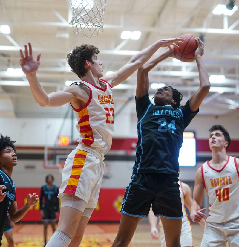 Batavia’s Jax Abalos (23) defends the paint against Hillcrest's Jaylen Ingram (24) during the 30th annual Jim & Silvia Roberts Night of Hoops at Batavia High School on Saturday, Jan 20, 2024.