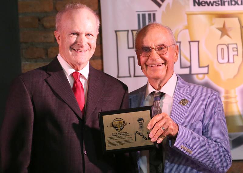 Western alumnus Lonnie Hewitt, who was a three-time state high jump champion poses with emcee Lanny Slevin during the 2025 Shaw Media Illinois Valley Sports Hall of Fame at the Auditorium Ballroom in La Salle.