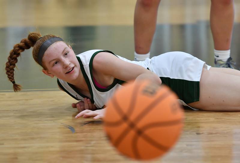 Glenbard West’s Sophia Evans watches the ball bounce away after she was tripped on the way to the basket during a game agains Downers Grove North on December 4, 2025 at Glenbard West High School in Glen Ellyn.