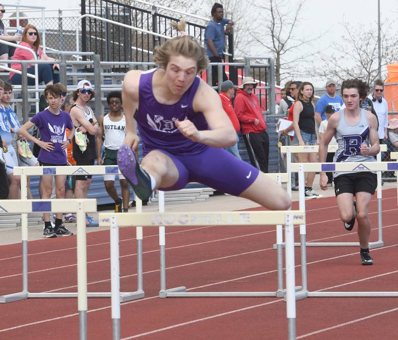 Dixon's Dawson Kemp clears a hurdle at the Hub Relays in Rochelle on Saturday, April 15.
