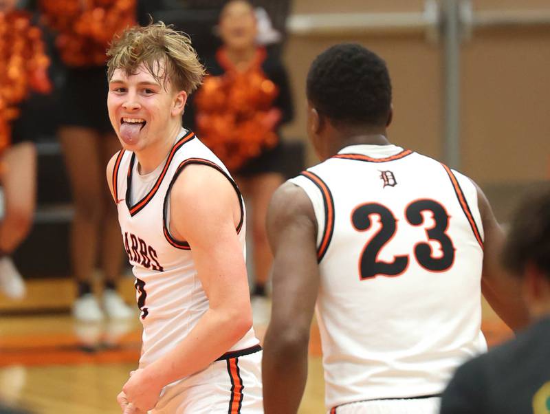 DeKalb's Sean Reynolds (left) and Davon Grant celebrate after Reynolds hit a big three pointer during their game Friday, Feb. 21, 2025, at DeKalb High School.