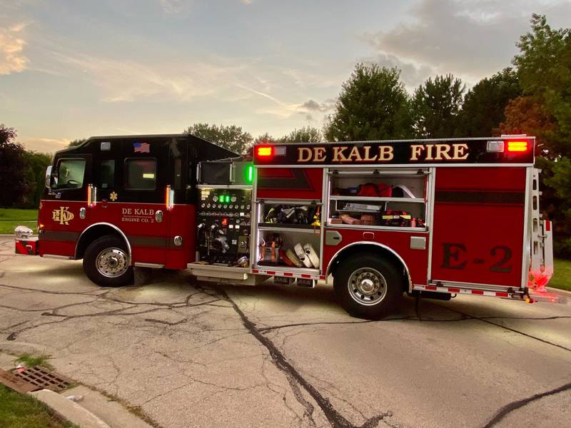 A DeKalb Fire Department fire truck is filled with emergency gear for a water rescue on Sunday, July 27, 2025, in the 600 block of Ridge Drive in DeKalb.