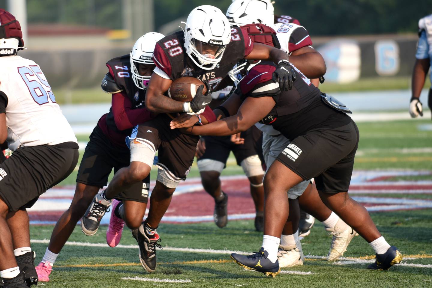 Kankakee's Jaymari Hairston splits the defense during a scrimmage at the Kays' summer camp Thursday, July 31, 2025.