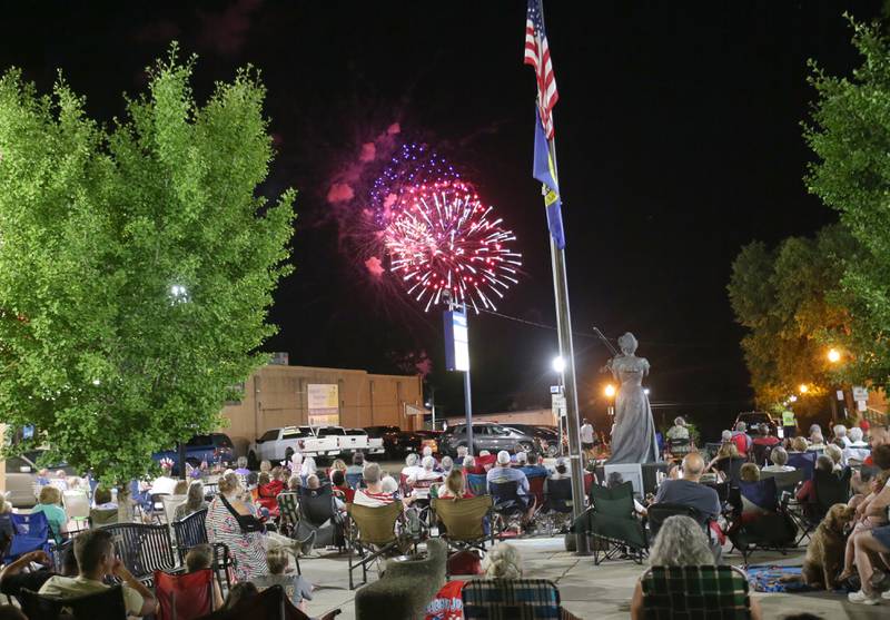 Red, white and blue fireworks fill the sky over Maud Powell Plaza during the "Rock the River" Independence Day fireworks on Thursday, July 3, 2025 in Peru.