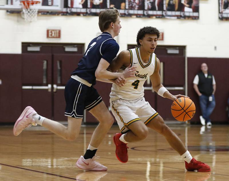 Crystal Lake South's Anthony Demirov brings the ball up the court against Cary-Grove's AJ Berndt during the IHSA Class 3A Prairie Ridge Regional championship basketball game on Friday, Feb. 28, 2025, at Prairie Ridge High School in Crystal Lake.