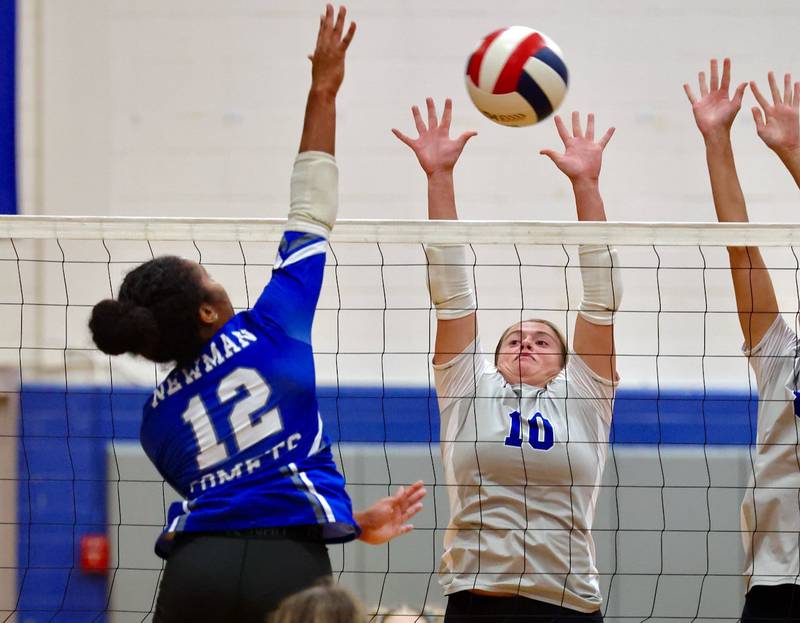 Newman's Gisselle Martin hits against Princeton's Makayla Hecht Tuesday night at Prouty Gym. The Tigresses won 2-0.