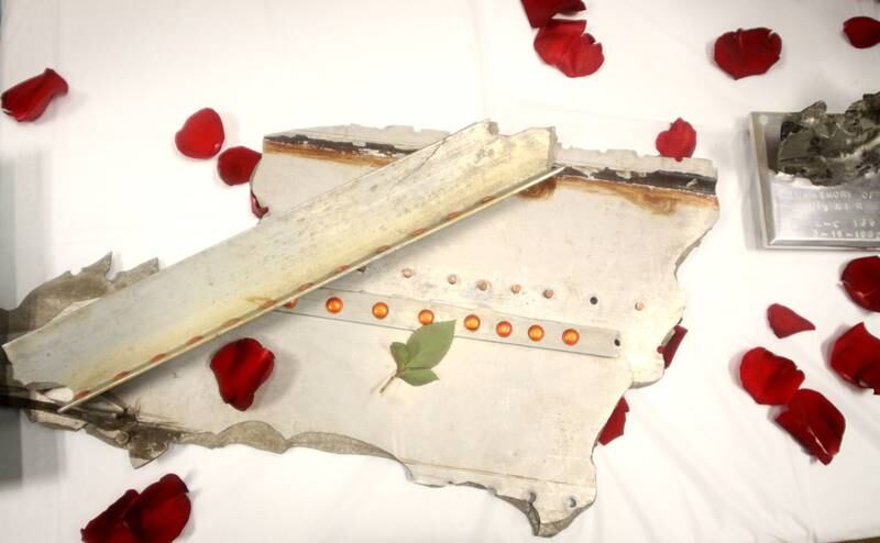 A piece of plane wreckage is strewn with rose petals. A remembrance was held Saturday at Wonder Lake Fire Protection District Station 2 on the 40th anniversary of a midair military jet explosion that happened over a small, rural area northeast of Woodstock.