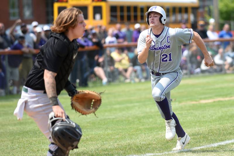 Wilmington's Lucas Rink, right, runs home as Bishop McNamara's Devin Arbour waits on a throw during the Class 2A Beecher Sectional championship game Saturday, May 31, 2025.