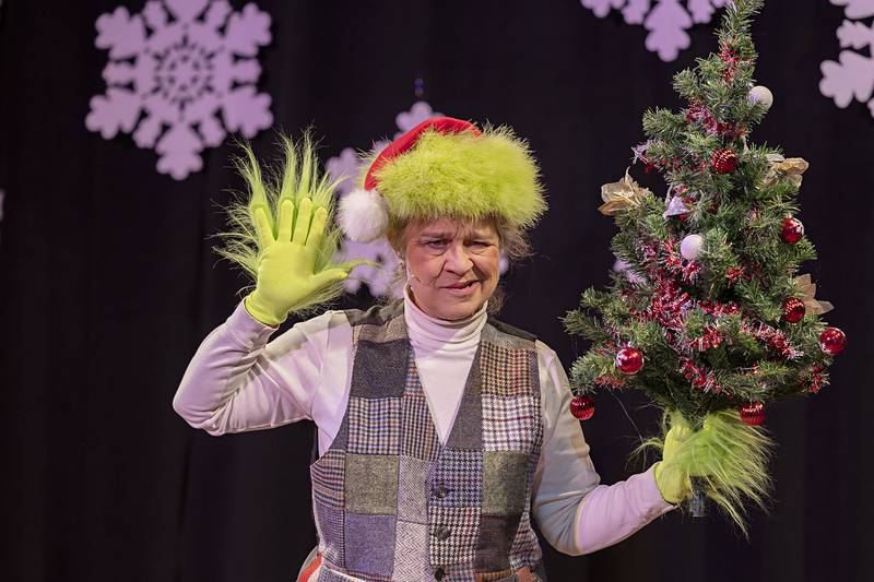 Connie Augsburger plays the part of the Grinch in one scene of Pinecrest Grove Theater’s “Every Christmas Story Ever Told (And Then Some!).”