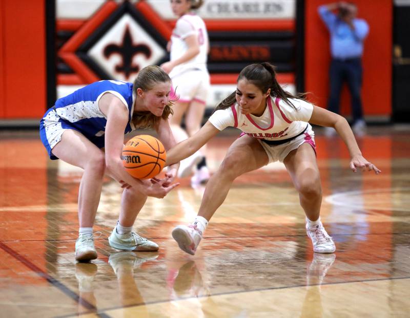 Wheaton North's Brigitte Noyes (left) and Batavia's Hallie Crane go after a loose ball during a Class 4A St. Charles East Sectional semifinal on Tuesday, Feb. 25, 2025 in St. Charles.