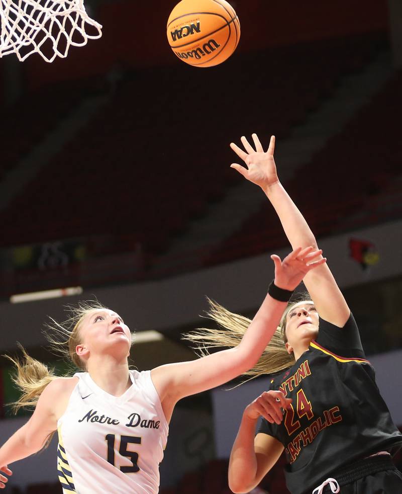 Montini's Peyton Farrell lets go of a shot over Quincy Notre Dame's Tristan Pieper during the Class 3A State semifinal game on Thursday, March 6, 2025 at CEFCU Arena in Normal.