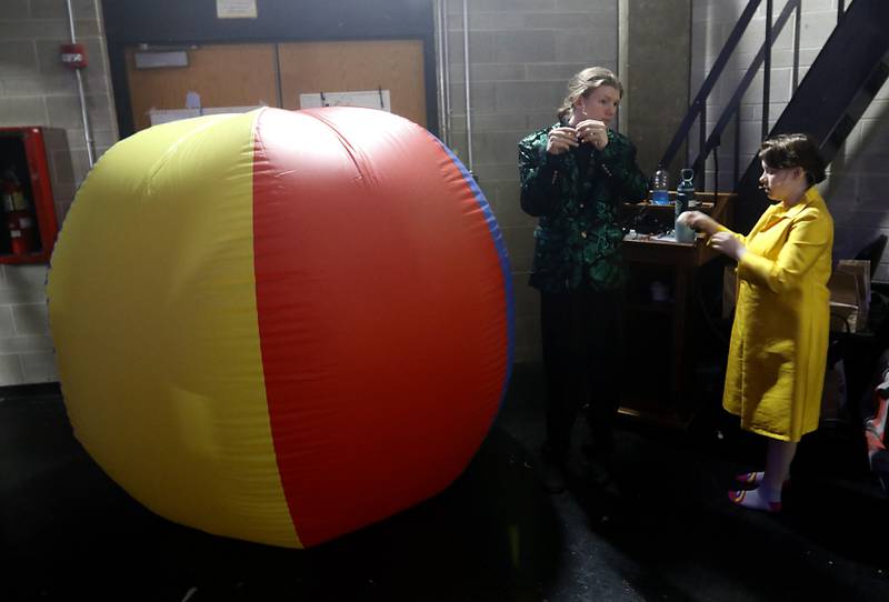 Caleb Bone, playing Sheldon J. Plankton, and KC Carson, playing Mrs. Puff, put on their microphones backstage before a rehearsal for the McHenry Community High School’s production of “The SpongeBob Musical” on Tuesday, March 7, 2023, at the school’s Upper Campus.