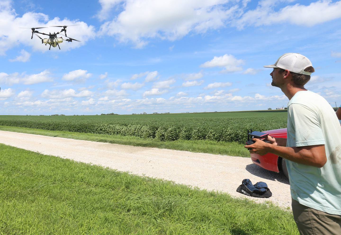 Silas Steiner owner of Thrive spray drone service, flies a DJI XAG P150 drone while spraying an application on Monday, July 28, 2025 near Wenona.  "We are still a very long way off from unmanned aircraft replacing manned aircraft. Drones are another tool in the bag to give precise spray applications but with the efficiency gap between a drone and an airplane I don't see manned aircraft leaving anytime soon," said Steiner.
