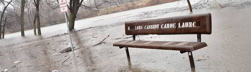 The Vermilion River rises over its banks at the Hopalong Cassidy Canoe Launch site in Streator.
