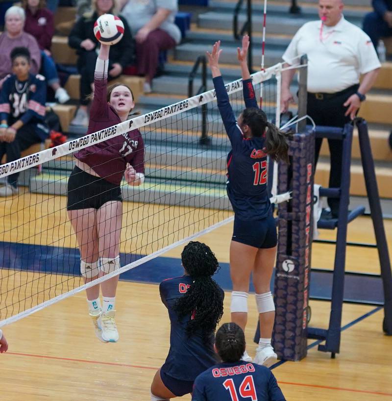 Lockport's Bridget Ferriter (17) goes up for a kill against Oswego during a class 4A Oswego Sectional semifinal match at Oswego High School on Monday, Oct. 30, 2023.