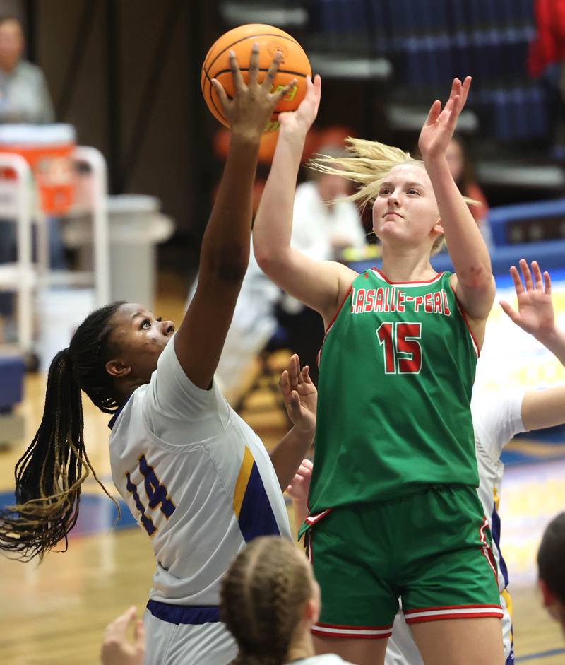 Somonauk-Leland's Leah Norris blocks the shot of La Salle-Peru's Margaret Boudreau during their game Thursday, Nov. 20, 2025, in the Tim Humes Breakout girls basketball tournament at Somonauk High School.