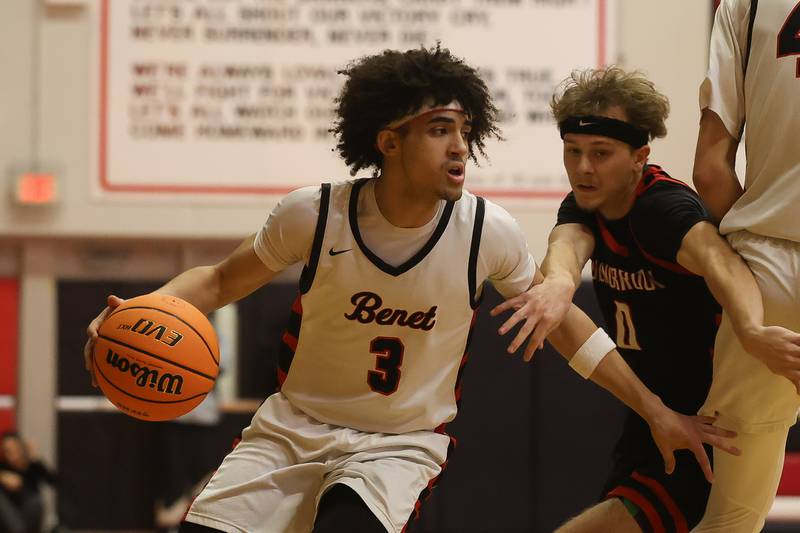 Benet’s Jayden Wright makes a move to the basket against Bolingbrook in the Class 4A Bolingbrook Sectional championship game on Friday, March 6, 2026 in Bolingbrook.