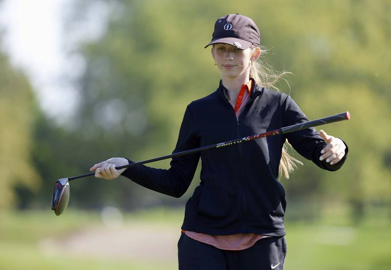 Abby Olson of Wheaton Warrenville South, reacts to her drive during the IHSA Class 2A West Chicago girls golf regional at St. Andrews Tuesday, Oct. 1, 2024 in West Chicago.
