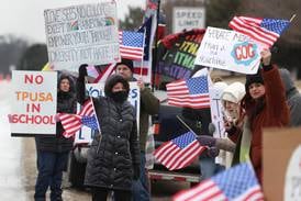 Photos: Protesters gather outside Genoa-Kingston High School during Turning Point USA event