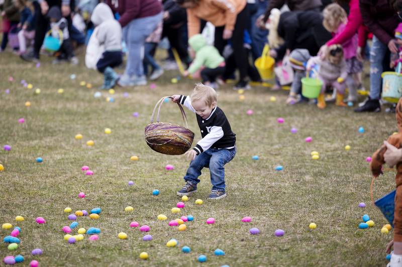 Oliver Ptasnik, 2, of Polo dashes off to grab eggs Saturday, March 30, 2024 during the hunt in Polo.