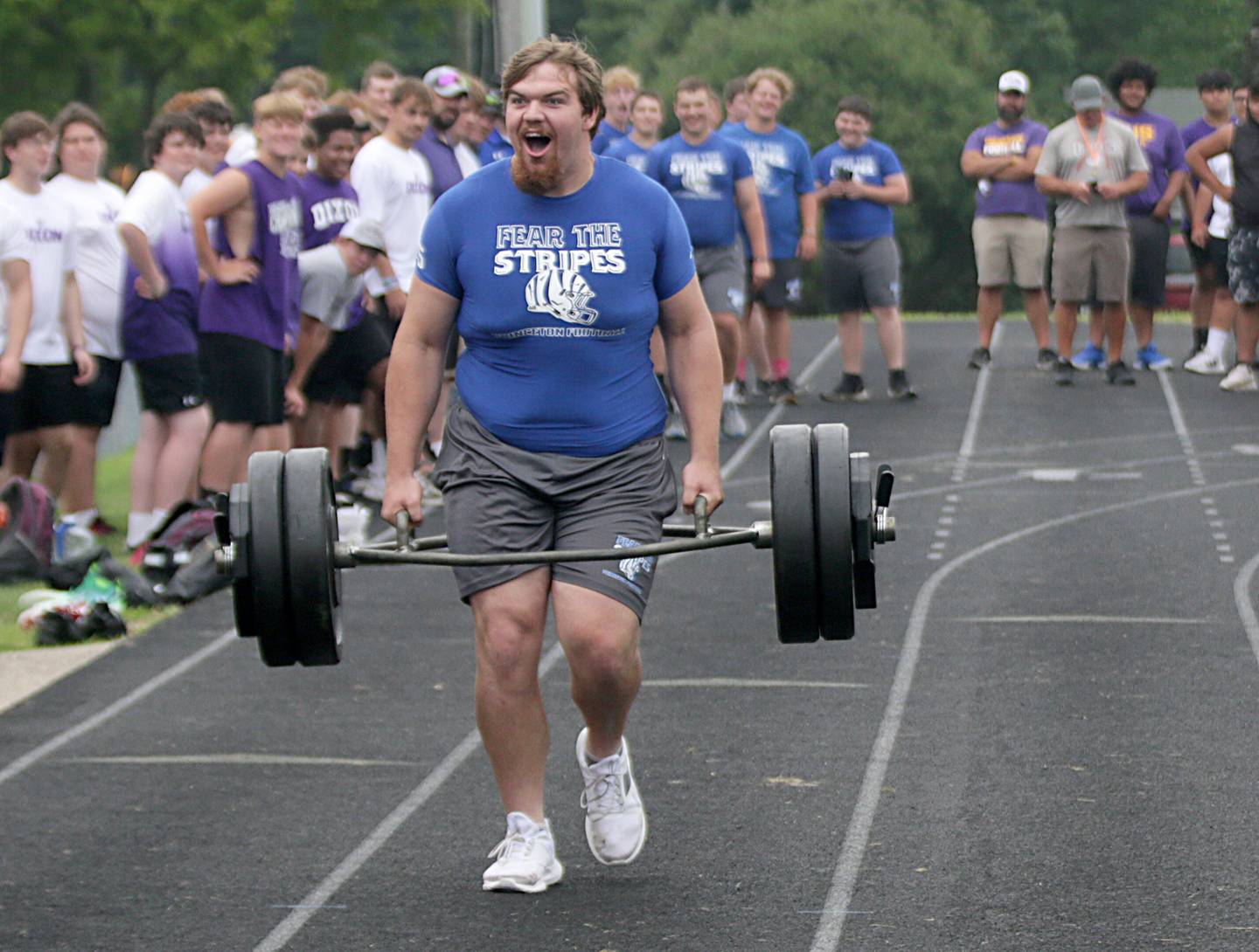 Princeton's Payne Miller carries 250 pounds during the linemans challenge during the 7-on-7 meet on Saturday, July 16, 2022 at Princeton High School.