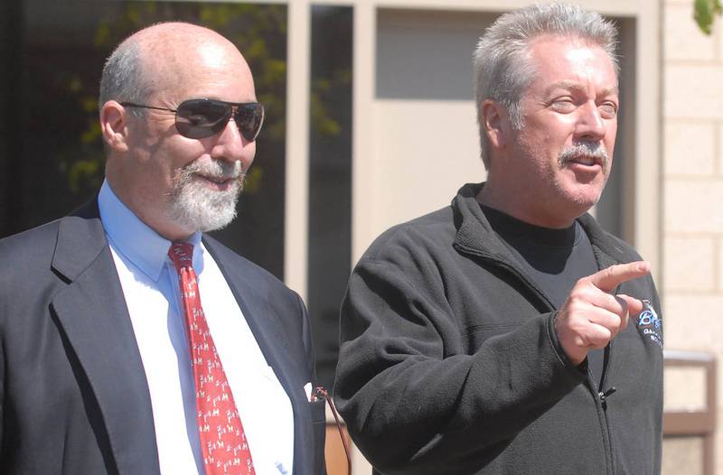 Drew Peterson (right) and his former attorney Joel Brodsky are seen May 21, 2008, leaving the Will County Jail. Peterson is facing new charges of attempting to solicit the murder of Will County State's Attorney James Glasgow. Brodsky says his former client is being set up.