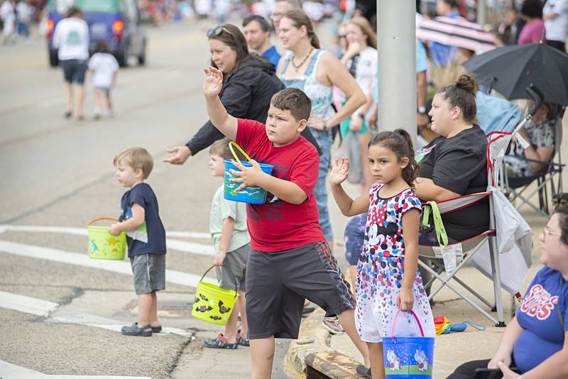 Children watching the parade eagerly await the next candy toss on Saturday, Sept. 17, 2022.