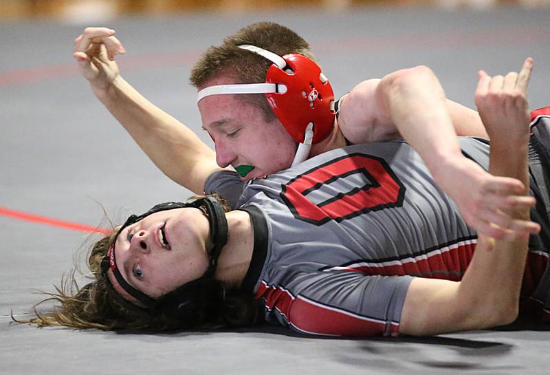 L-P's Zach Znaniecki wrestles Ottawa's James Laitila in the 120 weight match during a wrestling meet in Sellett Gymnasium on Wednesday Dec. 7, 2022 at L-P High School.