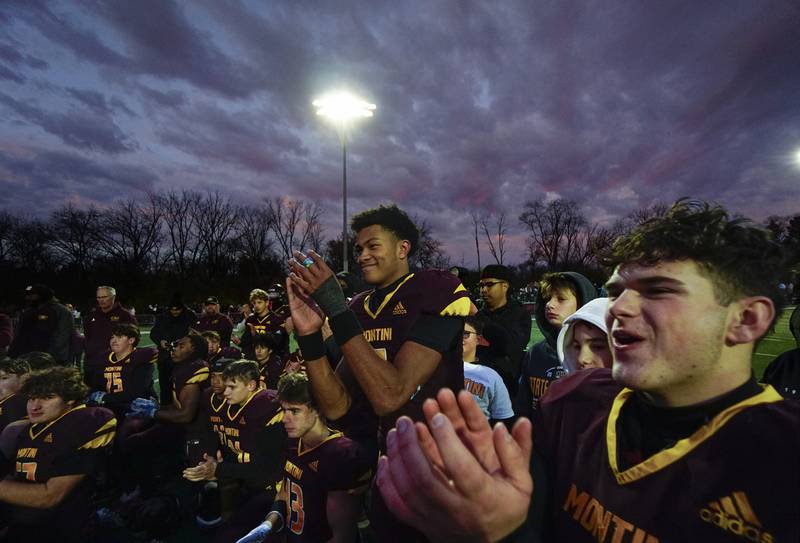 Montini's Israel Abrams (7) and his teammates celebrate beating Morris during the IHSA Class 4A semifinals football playoff game Saturday, Nov. 22, 2025 in Lombard.