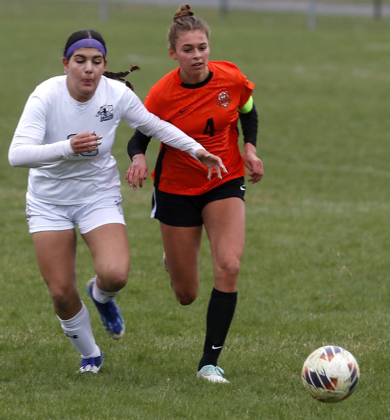 Kaneland's Adriana Warrington battles for position with Crystal Lake Central's Hadley Ferrero as the chase down the ball during a nonconference soccer game on Thursday, April 10, 2025, at Crystal Lake Central High School.