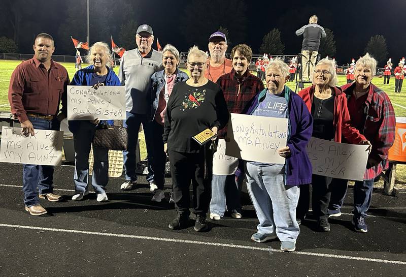 Colleen Alvey (center) was indcuted into Forreston High School's Hall of Fame during a halftime ceremony at halftime of the varsity football game in Oct. 4. Alvey taught many subjects but her main focus was  mathematics in both Leaf River and Forreston from 1973-2005.